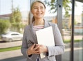 Productive working day. Happy senior lady, successful mature business woman holding laptop and looking aside with smile Royalty Free Stock Photo