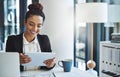 Productivity is certain using smart apps. a young businesswoman using a digital tablet in a modern office. Royalty Free Stock Photo