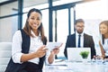 Productivity powered by digital technology. Cropped portrait of an attractive young businesswoman using a digital tablet Royalty Free Stock Photo