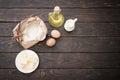 the products for its preparation dough on dark wooden background