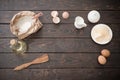 The products for its preparation dough on dark wooden background