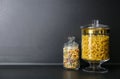 Products in modern kitchen glass containers on black table. Space for text Royalty Free Stock Photo