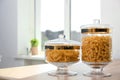 Products in modern kitchen glass containers on table Royalty Free Stock Photo