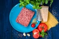 Products for the preparation of Pasta Bolognese. Minced meat, tomatoes, spaghetti, Basil, Parmesan cheese, spices Royalty Free Stock Photo