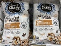 Products on a retail store shelf Sweet Chaos drizzled popcorn caramel