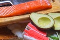 Products for sushi: rice, salmon, surimi crab sticks, nori kelp, cucumbers and avocado. Do it yourself