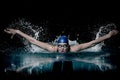 Profesional woman swimmer swim using breaststroke technique on the dark background