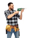 Happy male worker or builder with drill and tools Royalty Free Stock Photo