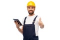 Worker or builder with tablet pc showing thumbs up Royalty Free Stock Photo