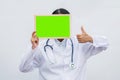 Profession doctor in white coat over white isolated background with white blank board and Thumbs up. Concept of healthcare, scienc Royalty Free Stock Photo