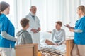 Doctors and helpful nurses with patients trying to find diagnose Royalty Free Stock Photo