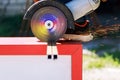 Profession, working profession, metalworking, equipment electric tools in the hands of a man at work cutting off metal with sparks