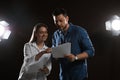 Professional actors reading their scripts during rehearsal in theatre Royalty Free Stock Photo