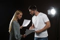 Professional actors reading their scripts during rehearsal in theatre Royalty Free Stock Photo