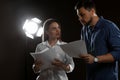 Professional actors reading scripts during rehearsal in theatre Royalty Free Stock Photo