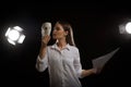 Actress rehearsing on stage in theatre