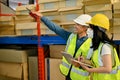 Professional adult Asian male warehouse manager and female worker are working together Royalty Free Stock Photo