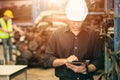 Professional adult Engineer male attending duty work in factory working checking stock inventory data with tablet computer