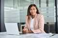 Professional African American business woman sitting at office desk, portrait. Royalty Free Stock Photo