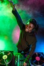professional african american club DJ in headphones with sound mixer Royalty Free Stock Photo