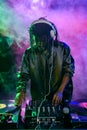 professional african american club DJ in headphones with sound mixer Royalty Free Stock Photo