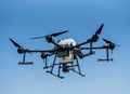 Professional agriculture drone flying in the blue sky