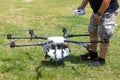 Professional agriculture drone on the green field during pre-fli