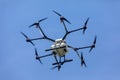 Professional agriculture drone on the green field during the tes