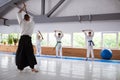 Professional aikido trainer teaching talented children in the gym