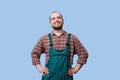 Professional appearance of Cheerful worker bearded man with arms on hips