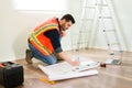 Contractor making some changes on the construction plans Royalty Free Stock Photo
