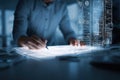 professional architect or software developer working on a futuristic digital touch interface with holographic blueprints and Royalty Free Stock Photo