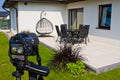 Shooting house exterior, photographer camera, tripod and ballhead Royalty Free Stock Photo