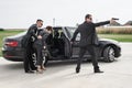 Security team of bodyguards protect celebrity vip in car limousine Royalty Free Stock Photo