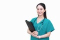 Professional Asian beautiful young woman doctor standing smiling in a green lab shirt, holding patient documents in hand isolated Royalty Free Stock Photo