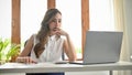 Professional Asian businesswoman focused working on her project, looking at the laptop screen Royalty Free Stock Photo