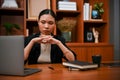 Professional Asian businesswoman is pensively thinking about a business plan in the office Royalty Free Stock Photo