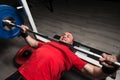 Athlete of Powerlifter Attempt Benchpress a Heavy Barbell