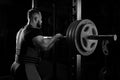 Professional athlete prepares to squat with a barbell