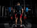 Professional athlete stands in front of the bars with a barbell Royalty Free Stock Photo