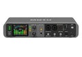 Professional audio interface with multiple knobs and indicators on a sleek grey surface Royalty Free Stock Photo