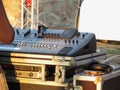 Professional audio mixing console with faders and adjusting knobs for party outdoor at sunset