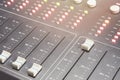Professional audio mixing console with faders and adjusting knobs - radio Royalty Free Stock Photo