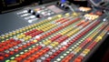 Professional audio mixing console with faders and adjusting knobs, TV equipment Black White selective focus