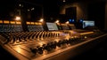 Professional audio mixing console with faders and knobs in studio Royalty Free Stock Photo
