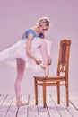 Professional ballerina putting on her ballet shoes Royalty Free Stock Photo