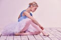 Professional ballerina putting on her ballet shoes Royalty Free Stock Photo