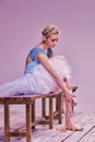 Professional ballerina putting on her ballet shoes Royalty Free Stock Photo