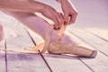 Professional ballerina putting on her ballet shoes Royalty Free Stock Photo