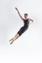 Professional Ballet Dancer Young Caucasian Athletic Man in Black Suit Posing Flying Dancing in Studio On White Royalty Free Stock Photo